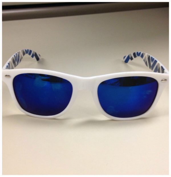 TrueSport branded white sunglasses with blue lenses.