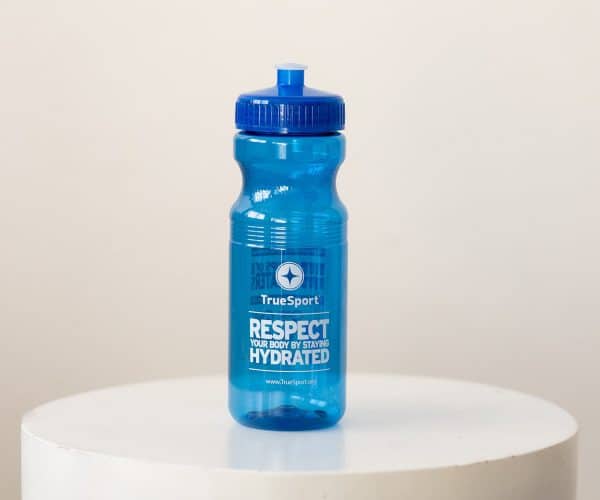 One side of the blue TrueSport branded water bottle.
