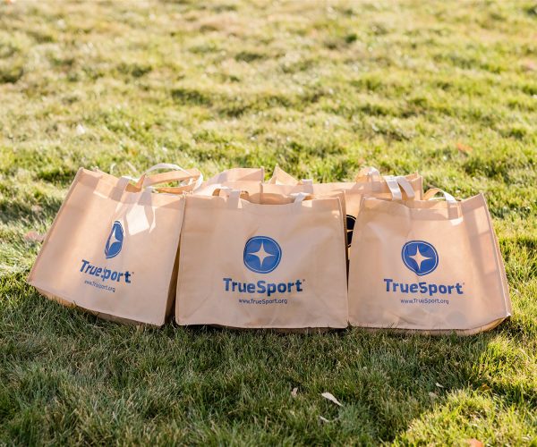 Tan TrueSport-branded shoulder bags.