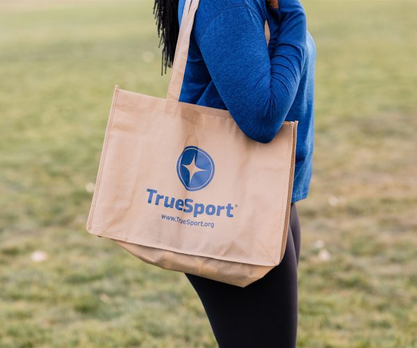 Tan TrueSport-branded shoulder bag.