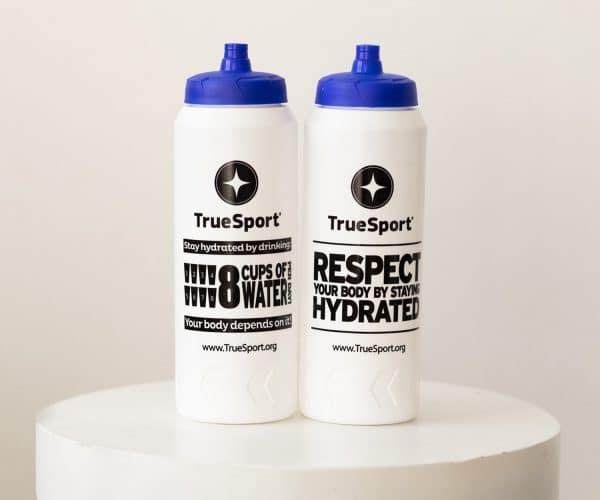 Two white TrueSport-branded water bottles.